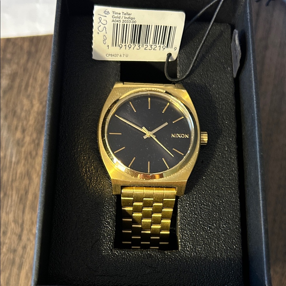 Nixon Gold and Black Men's Timepiece